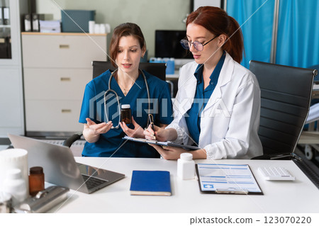 Diversity, medical team head leaders discuss results, brainstorming and planning. 123070220