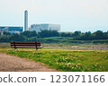 Summer afternoon landscape with a riverside bench 123071166