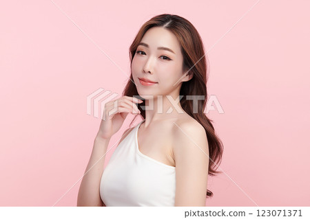 Beautiful young asian woman with clean fresh skin on pink background, Face care, Facial treatment, Cosmetology, beauty and spa, Asian women portrait. Beautiful young asian woman with clean fresh skin on pink background, Face care, Facial treatment, Cosmetology, beauty and spa, Asian women portrait. 123071371