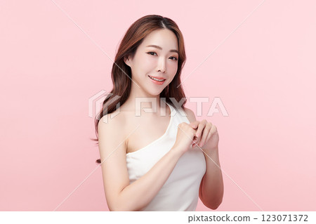 Beautiful young asian woman with clean fresh skin on pink background, Face care, Facial treatment, Cosmetology, beauty and spa, Asian women portrait. Beautiful young asian woman with clean fresh skin on pink background, Face care, Facial treatment, Cosmetology, beauty and spa, Asian women portrait. 123071372