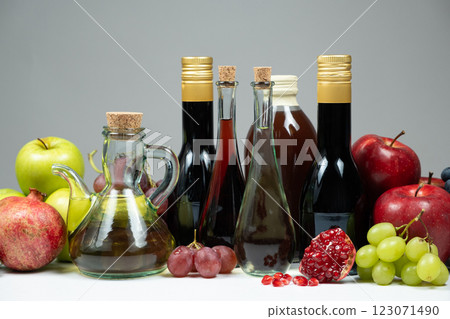 Different types of vinegar, apple, balsamic, wine and pomegranate vinegars in bottles Different types of vinegar, apple, balsamic, wine and pomegranate vinegars in bottles 123071490