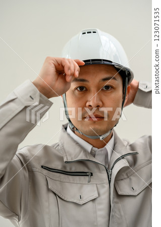 Male worker in work clothes Male worker in work clothes 123071535