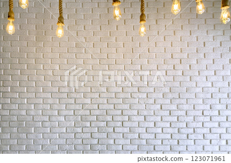 White Brick Wall with Burning Glass Light Bulbs 123071961