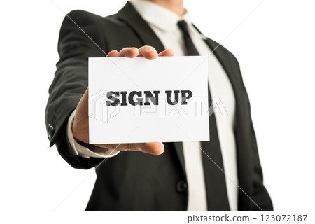 Businessman holding up a business card saying Sign up 123072187