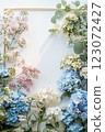 Vertical frame of pastel blue and pink hydrangeas flowers with empty space in the middle 123072427