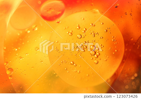 Oil in water, abstract background in yellow,orange and red color tones Oil in water, abstract background in yellow,orange and red color tones 123073426