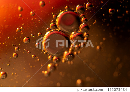 Oil in water, abstract background in golden and red color tones Oil in water, abstract background in golden and red color tones 123073484