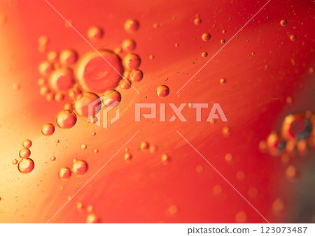 Oil in water, abstract background in yellow and red color tones Oil in water, abstract background in yellow and red color tones 123073487