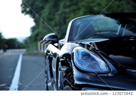 Headlights of a black convertible 123073842