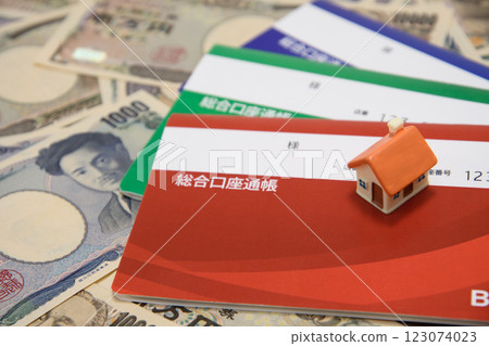 Money, bankbook and house 123074023