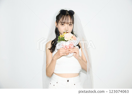 Portrait of a young woman dressed for a street wedding 123074063