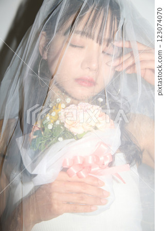 Portrait of a young woman dressed for a street wedding 123074070