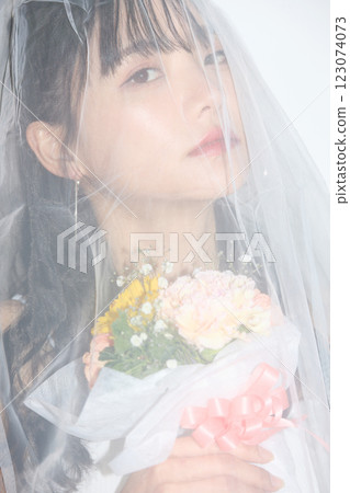 Portrait of a young woman dressed for a street wedding 123074073