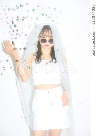 Portrait of a young woman dressed for a street wedding Portrait of a young woman dressed for a street wedding 123074086