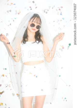 Portrait of a young woman dressed for a street wedding Portrait of a young woman dressed for a street wedding 123074087