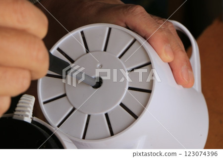 Fan cleaning and repair 123074396