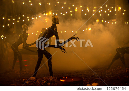 Spooky Halloween decoration stands in a wooded area creating a sinister atmosphere Spooky Halloween decoration stands in a wooded area creating a sinister atmosphere 123074464