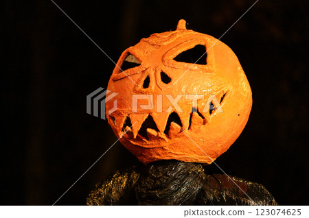 Spooky Halloween pumpkin decoration on black night background Spooky Halloween pumpkin decoration on black night background 123074625