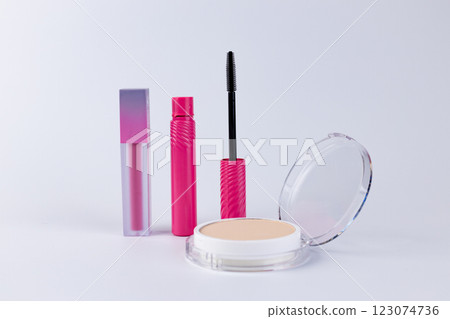 A Versatile Collection of Makeup Products Featuring Colorful Lipstick, Vibrant Mascara, and a Smooth Foundation Compact for Flawless Beauty Looks and Everyday Use 123074736