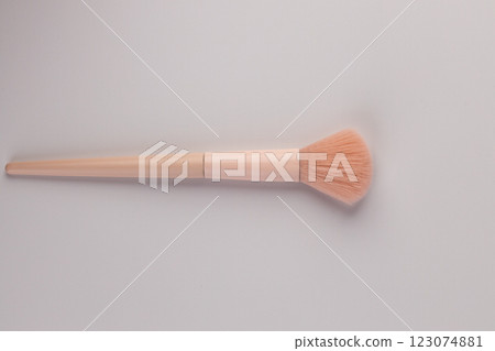 Elegant Makeup Brush on a Simple Background: A Beauty Tool Perfect for Application and Blending Makeup with Precision and Ease Elegant Makeup Brush on a Simple Background: A Beauty Tool Perfect for Application and Blending Makeup with Precision and Ease 123074881