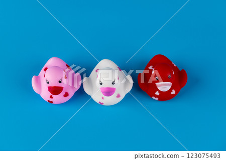 Playful Rubber Duck Collection: Adorable Pink, White, and Red Ducks with Heart Patterns on a Bright Blue Background for Celebrations and Fun Playful Rubber Duck Collection: Adorable Pink, White, and Red Ducks with Heart Patterns on a Bright Blue Background for Celebrations and Fun 123075493