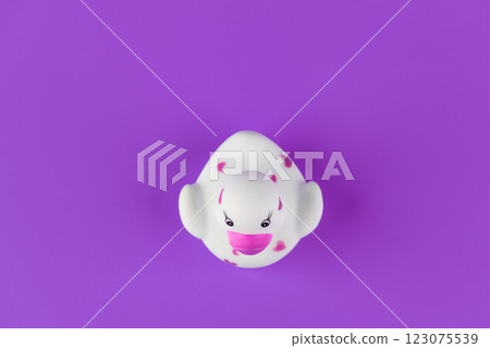 Adorable White Rubber Duck with Pink Hearts on a Bright Purple Background, Perfect for Bath Time Fun and Colorful Decor 123075539