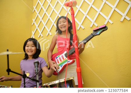 live concert at home two little girls playing live concert at home two little girls playing 123077584