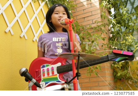 live concert at home little girl playing live concert at home little girl playing 123077585