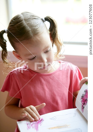 Little toddler girl writing at school desk Little toddler girl writing at school desk 123077608