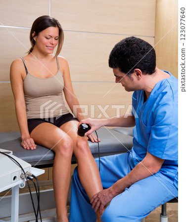 Ultrasonic therapy machine treatment doctor and woman 123077640