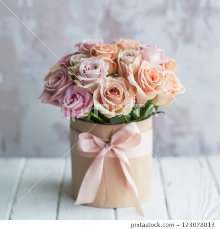 Elegant Arrangement of Pink Roses in a Decorative Gift Box with Ribbon Elegant Arrangement of Pink Roses in a Decorative Gift Box with Ribbon 123078013