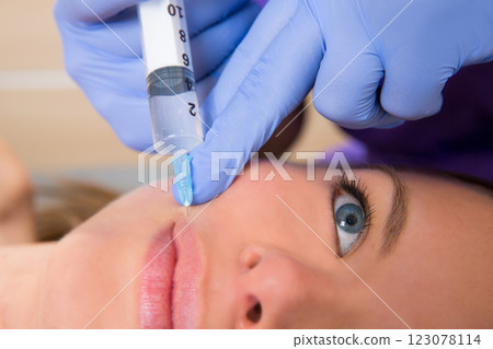 Anti aging facial mesotherapy syringe on woman face Anti aging facial mesotherapy syringe on woman face 123078114
