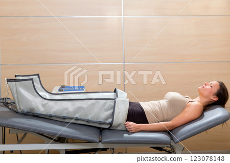 legs pressotherapy machine on woman patient in hospital legs pressotherapy machine on woman patient in hospital 123078148