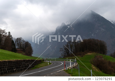 Winding mountain road in Canton of St. Gallen, Glarus Alps region, Switzerland, Europe. Winding mountain road in Canton of St. Gallen, Glarus Alps region, Switzerland, Europe. 123078291