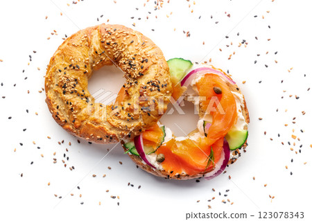 Lox bagel. A sandwich with smoked salmon and fresh vegetables on white 123078343