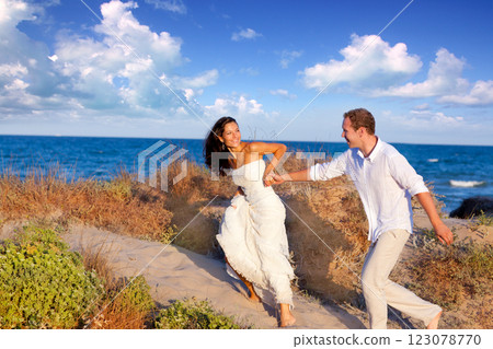 couple in love running at the beach 123078770
