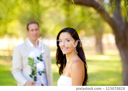 couple just married with man holding flowers couple just married with man holding flowers 123078828