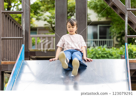 Girl playing on the slide 123079291