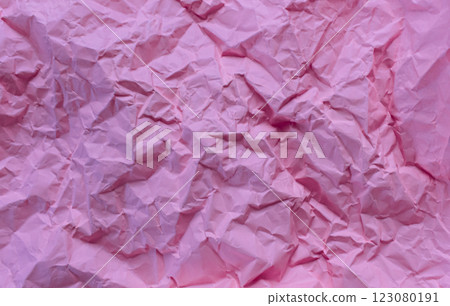 Wrinkled or crumpled pink paper texture used as a white paper background texture in design Wrinkled or crumpled pink paper texture used as a white paper background texture in design 123080191