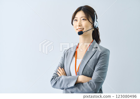Female operator wearing an intercom Filming cooperation: SKY Perfect Tokyo Media Center Female operator wearing an intercom Filming cooperation: SKY Perfect Tokyo Media Center 123080496