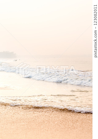 Gentle morning seascape with waves and golden sand 123082011