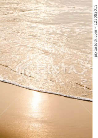 An ocean beach with calm waves 123082015