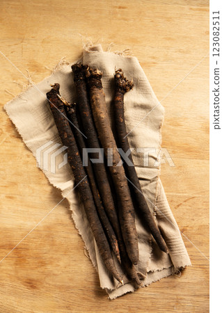 Dietary medicinal earth vegetable scorzonera on a napkin, top view 123082511