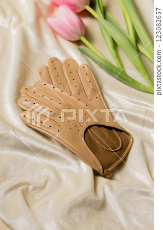 Beige gloves with pink tulips Beige gloves with pink tulips 123082657