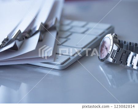 Documents, keyboard, and watch on the table Documents, keyboard, and watch on the table 123082814
