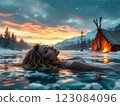 Woman relaxing in magical frozen lake at sunset near campsite 123084096
