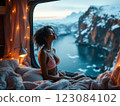 Young woman relaxing in camper van enjoying stunning mountain view 123084102