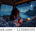 Woman relaxing in camper van at night enjoying starry sky and ocean view 123084105