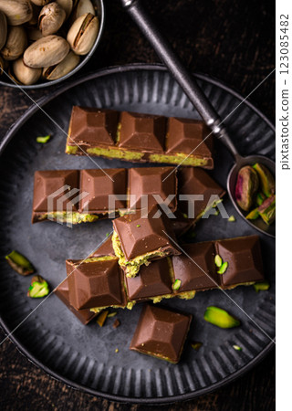 Dubai chocolate with kadayif pistachio filling Dubai chocolate with kadayif pistachio filling 123085482