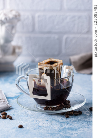 Freshly brewed drip coffee in glass cup 123085483